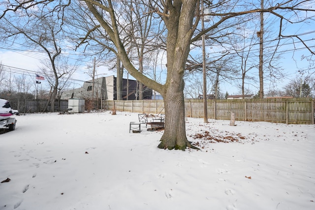 view of yard layered in snow