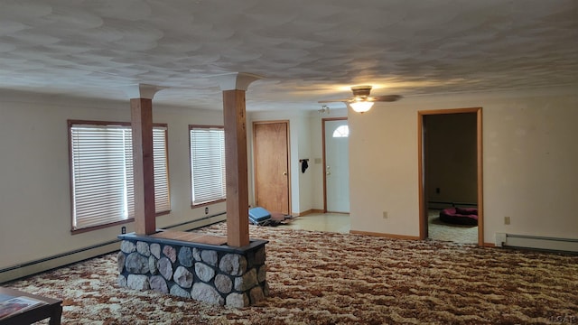 living room with baseboard heating and ceiling fan