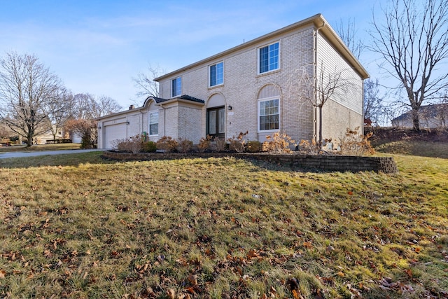 view of front property with a front yard and a garage