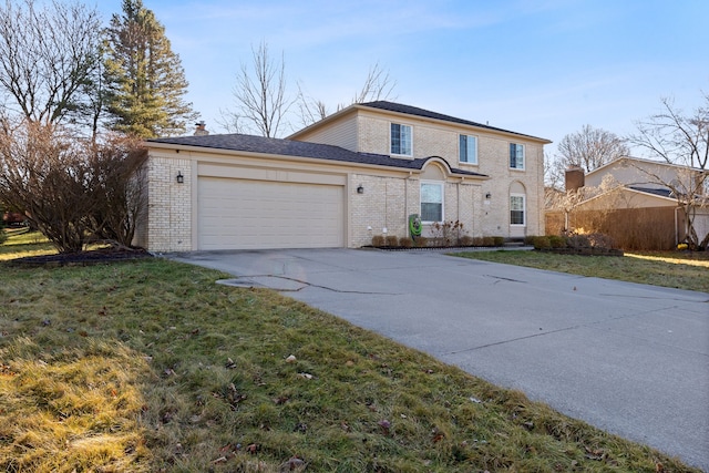 front of property featuring a front lawn and a garage