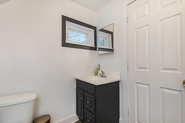 bathroom with toilet and vanity