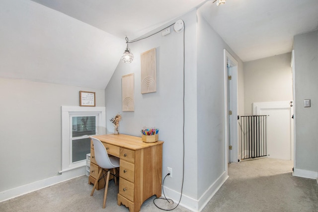 office featuring light colored carpet and vaulted ceiling