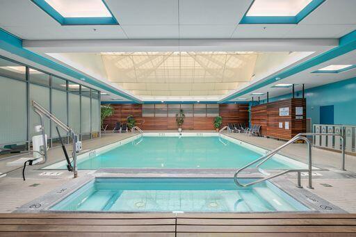 view of pool featuring a skylight