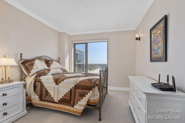 carpeted bedroom featuring a textured ceiling and ornamental molding