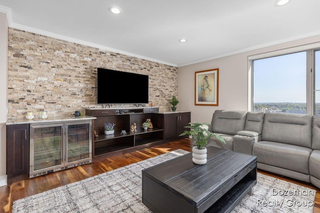 living room with ornamental molding and hardwood / wood-style flooring