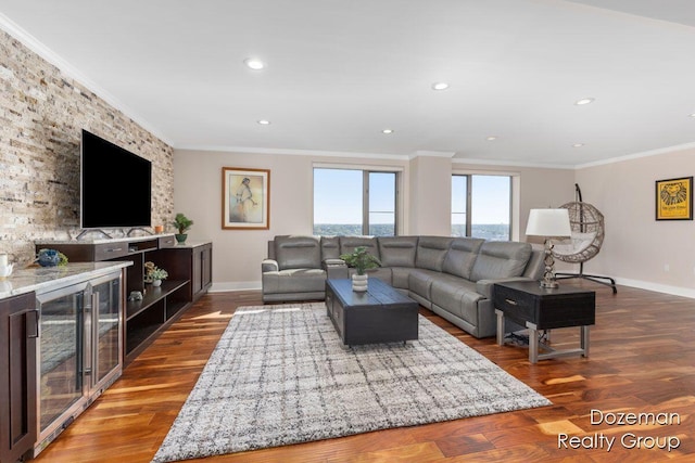 living room featuring crown molding and hardwood / wood-style flooring