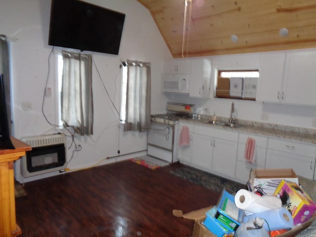 kitchen featuring white cabinetry, sink, heating unit, and white appliances