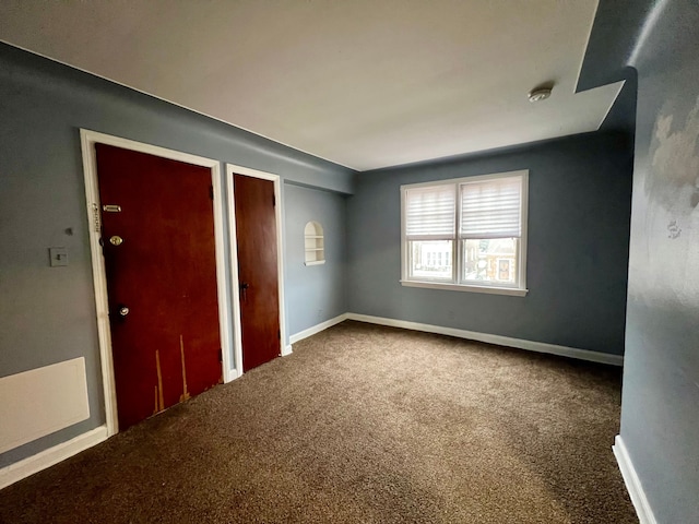 empty room with carpet flooring