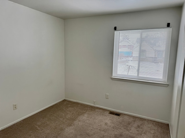 view of carpeted spare room