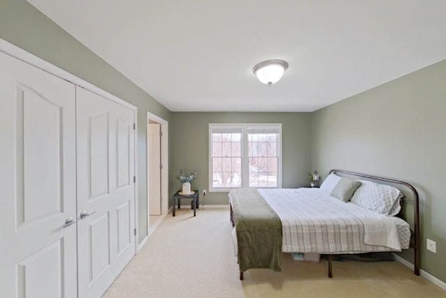 bedroom with light carpet