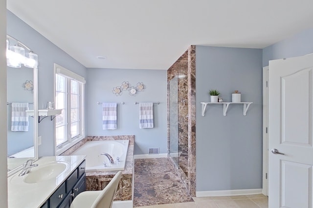 bathroom with vanity, tile patterned floors, and independent shower and bath