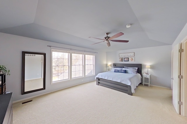 carpeted bedroom with lofted ceiling and ceiling fan