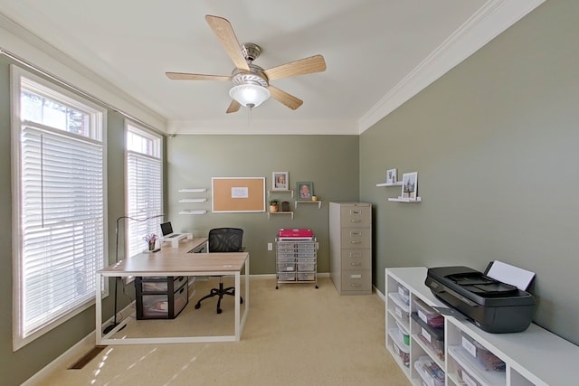 office with crown molding, light carpet, and ceiling fan