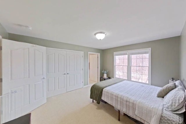 carpeted bedroom featuring a closet