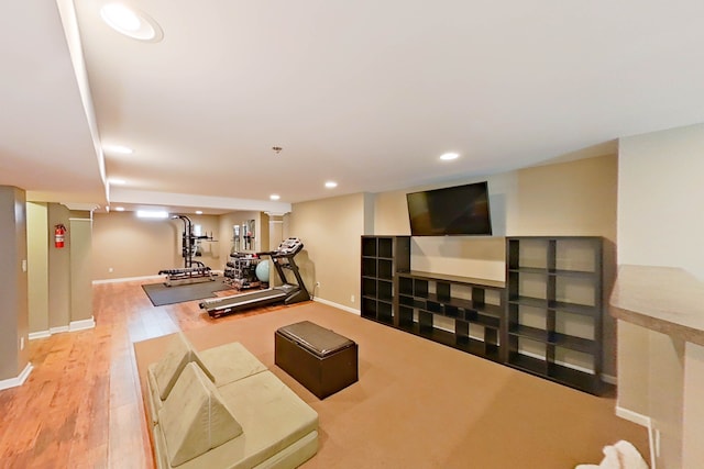 workout area with wood-type flooring