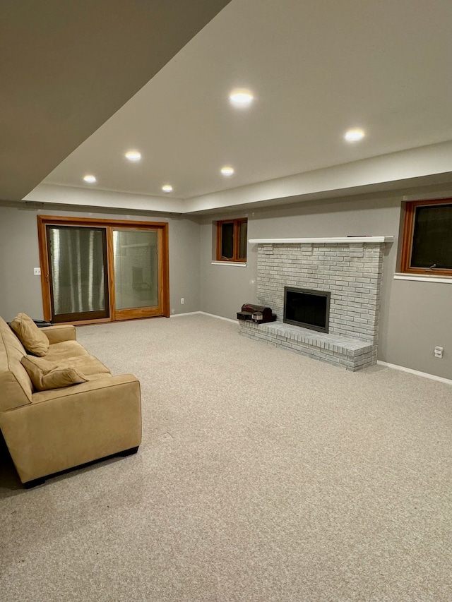 carpeted living room with a fireplace