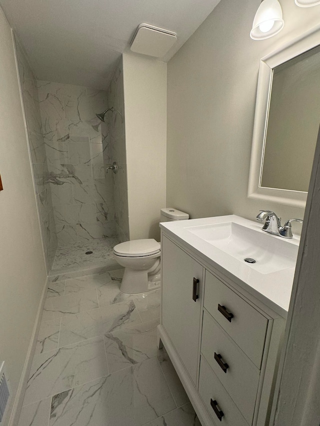 bathroom featuring toilet, walk in shower, and vanity