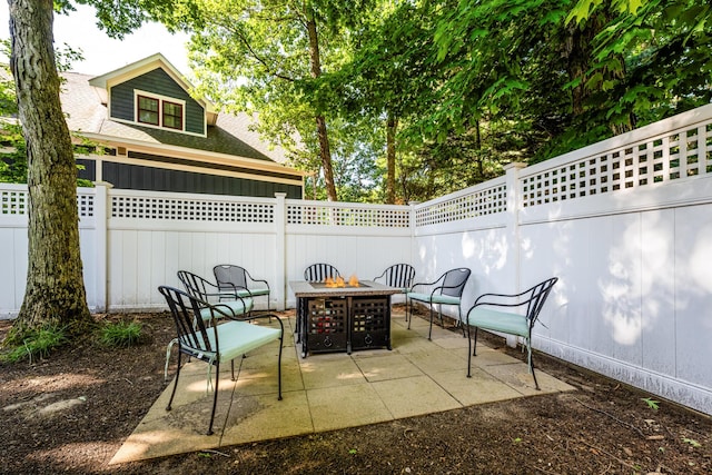 view of patio / terrace with a fire pit