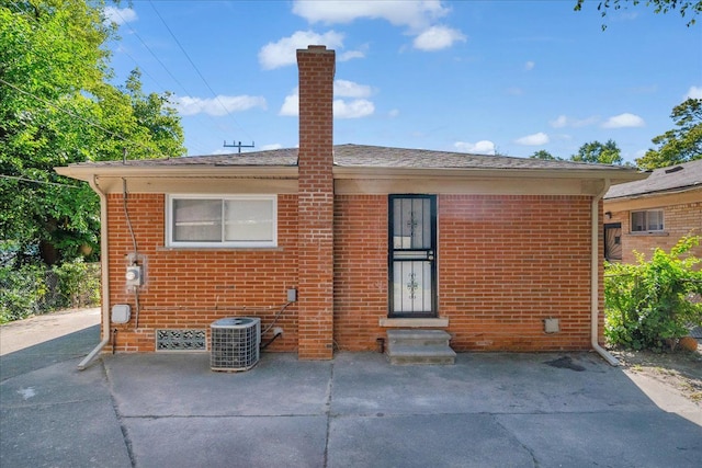 back of property with a patio and cooling unit