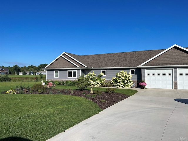 single story home with a front yard and a garage