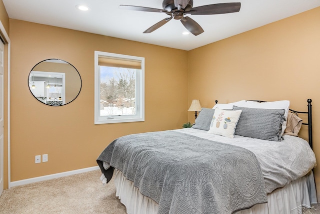 bedroom with light carpet and ceiling fan