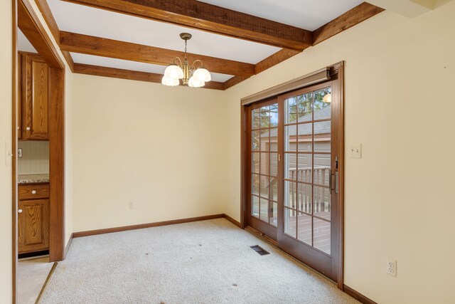 unfurnished dining area with beam ceiling, visible vents, a notable chandelier, and baseboards