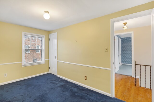 empty room with baseboards