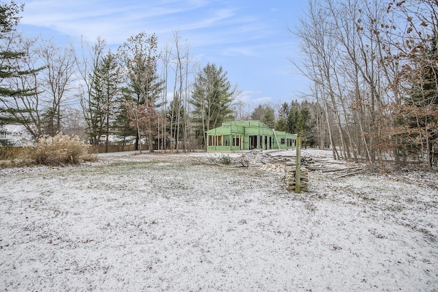 view of yard covered in snow