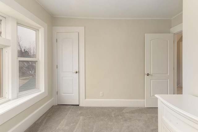 carpeted spare room with ornamental molding