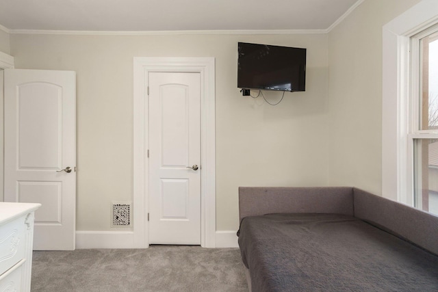 unfurnished bedroom featuring crown molding and light carpet