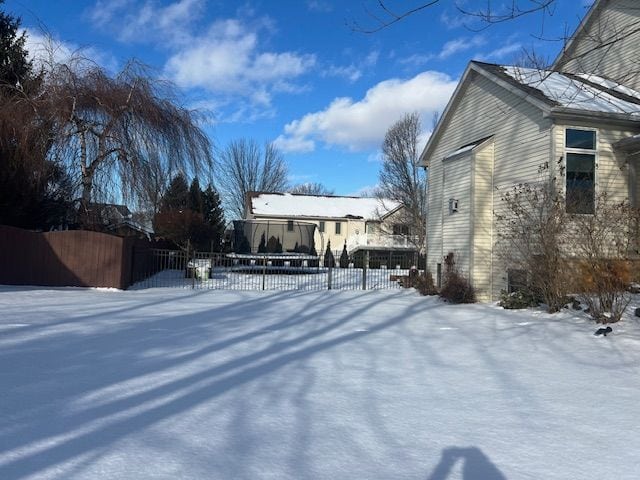 view of yard layered in snow