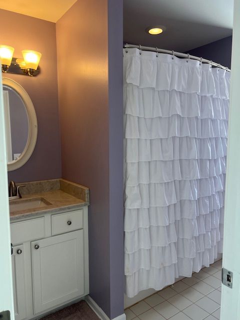 bathroom with vanity and tile patterned floors