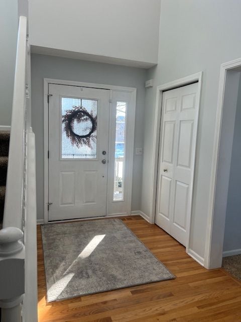 foyer entrance with light hardwood / wood-style floors