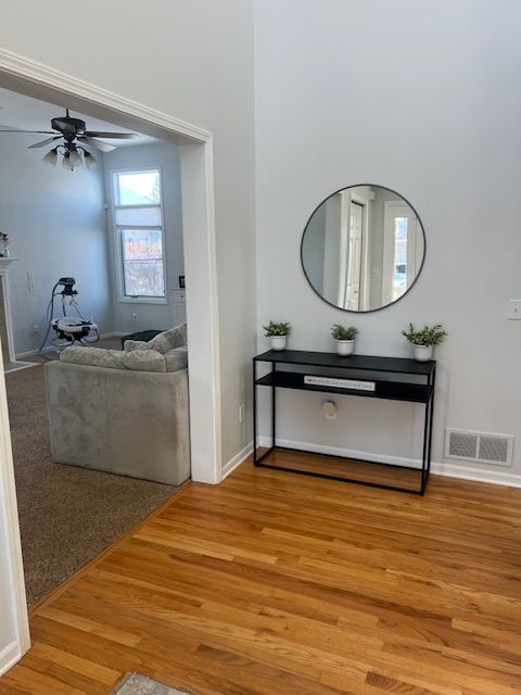 interior space featuring ceiling fan and hardwood / wood-style flooring