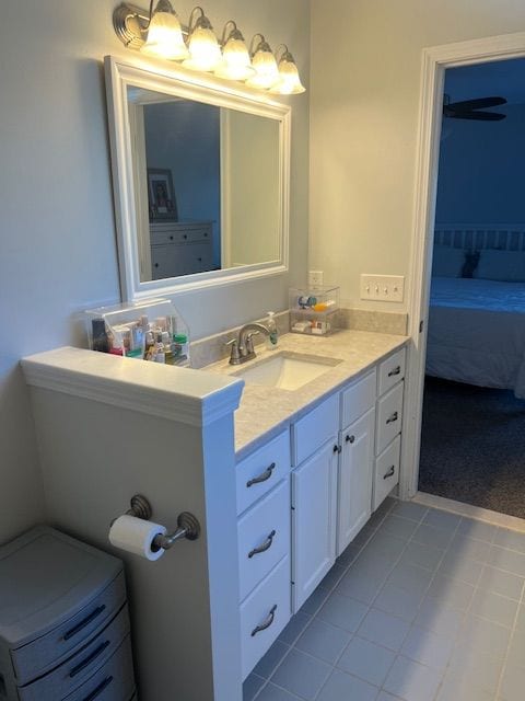 bathroom with tile patterned floors and vanity