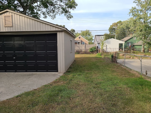 garage with a lawn