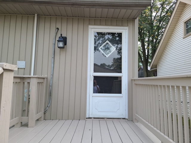 property entrance with a deck