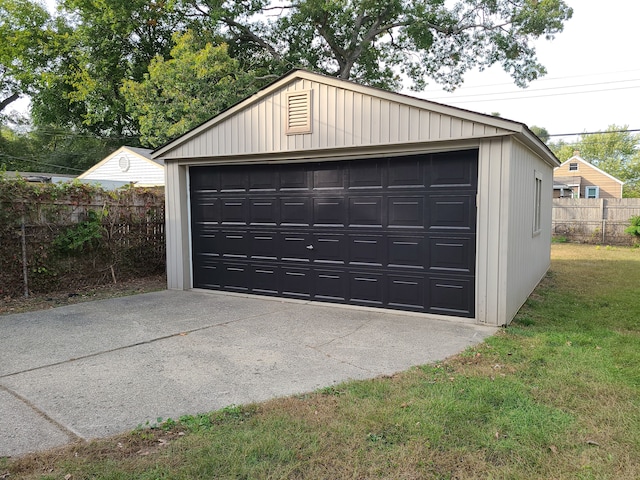 garage featuring a yard