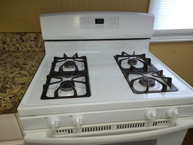 interior details featuring white range with gas stovetop