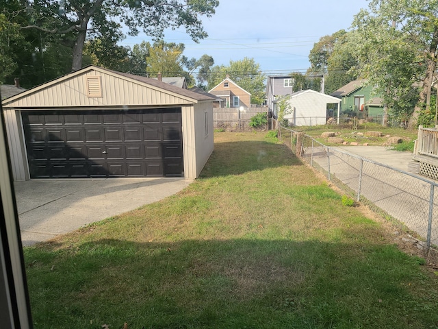 garage with a yard