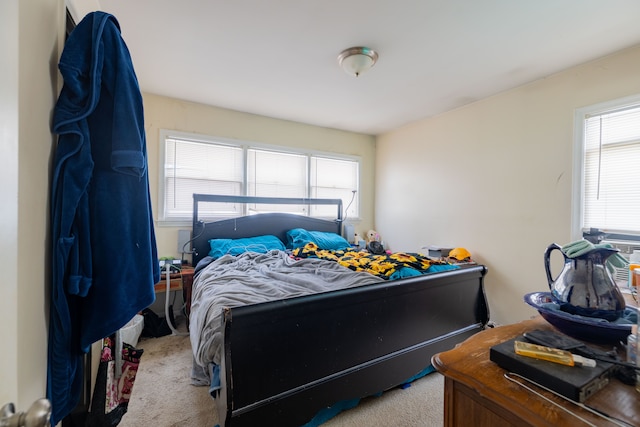 bedroom featuring light colored carpet