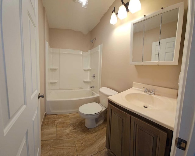 full bathroom featuring toilet, vanity, and washtub / shower combination