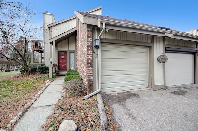 view of front of home featuring a balcony and a garage