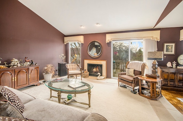 living room featuring a healthy amount of sunlight, vaulted ceiling, and light parquet flooring