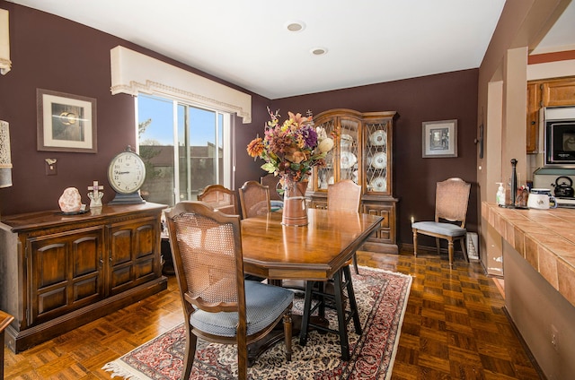 dining room with dark parquet floors