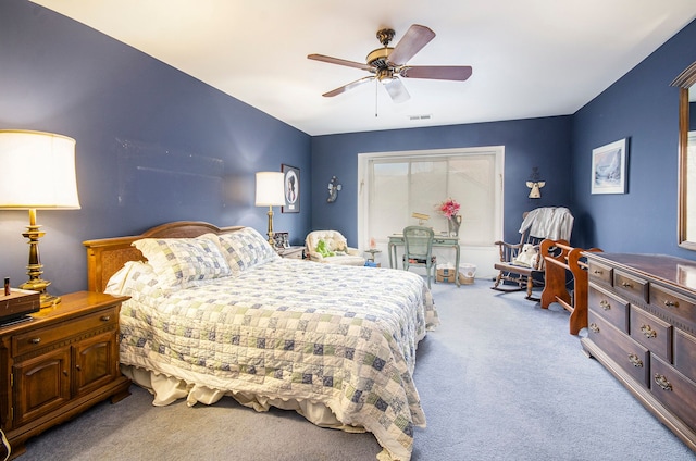 bedroom featuring light colored carpet and ceiling fan