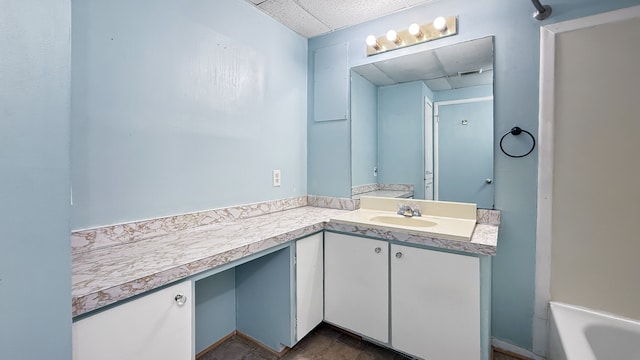 bathroom with a tub to relax in and vanity