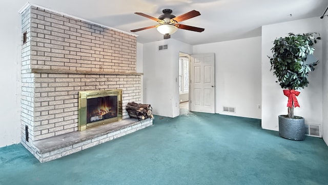 unfurnished living room featuring ceiling fan, a brick fireplace, and dark colored carpet