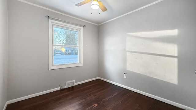 empty room with ceiling fan, ornamental molding, and dark wood-type flooring