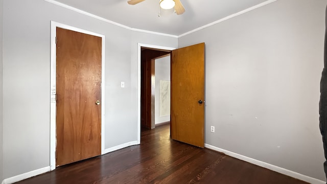 unfurnished bedroom featuring ceiling fan, crown molding, and dark hardwood / wood-style floors